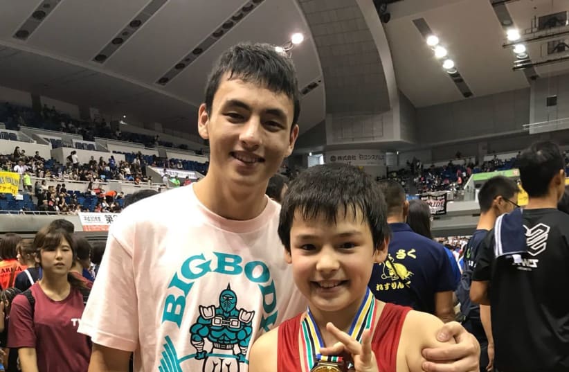 Noah Leibowitz a Japanese Orthodox Jewish wrestler with his first-prize medal at an All-Japan youth wrestling championship Monday, 30 2018. (photo credit: DAVID LEIBOWITZ)