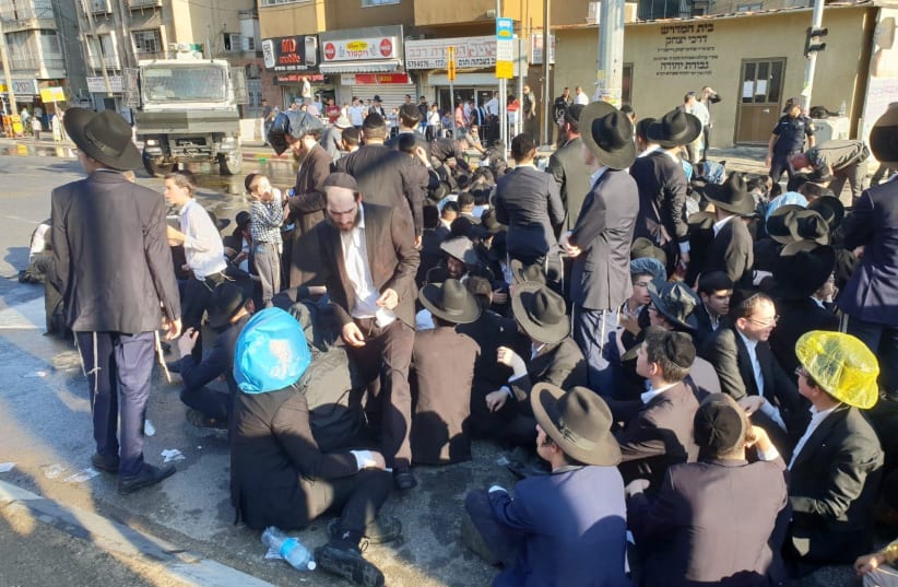 Ultra-Orthodox demonstrators block roads in Bnei Brak, August 6, 2018 (photo credit: ISRAEL POLICE)