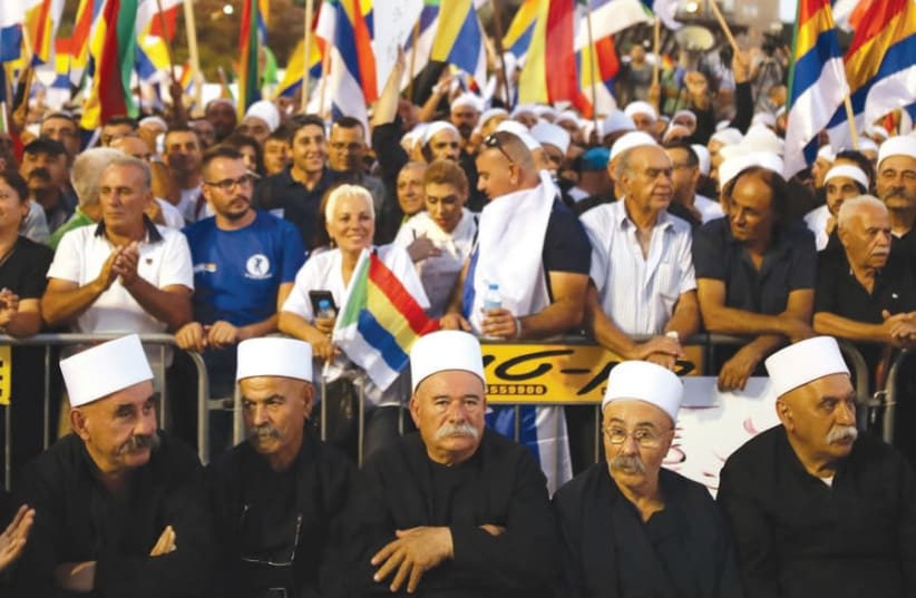 Druze leaders partake in the protest against the Nation-State Law in Tel Aviv, August 2018 (photo credit: CORINNA KERN/REUTERS)