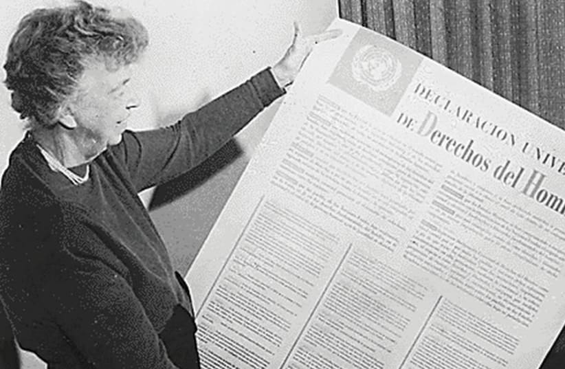 Then-US delegate to the United Nations General Assembly Eleanor Roosevelt holds the UN Universal Declaration of Human Rights in Spanish, in 1948 (photo credit: Wikimedia Commons)