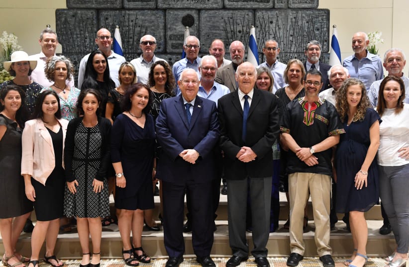 President Reuven Rivlin with members of the Telfed deleqation. Rivlin is flanked by Telfed Chairwoman Batya Shmukler and former Telfed chairman Hertzel Katz.  (photo credit: KOBI GIDEON/GPO)