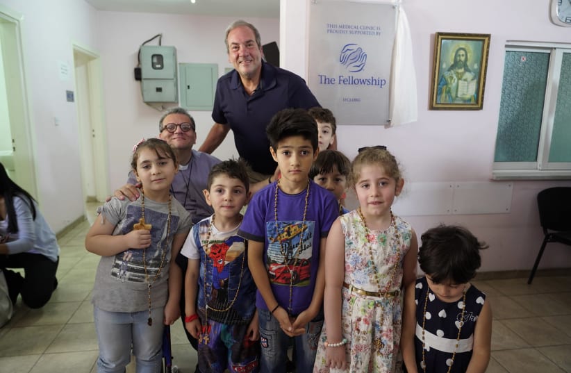 Rabbi Yechiel Eckstein visiting an IFCJ-sponsored medical clinic in Amman that treats Christian refugees (photo credit: Courtesy)