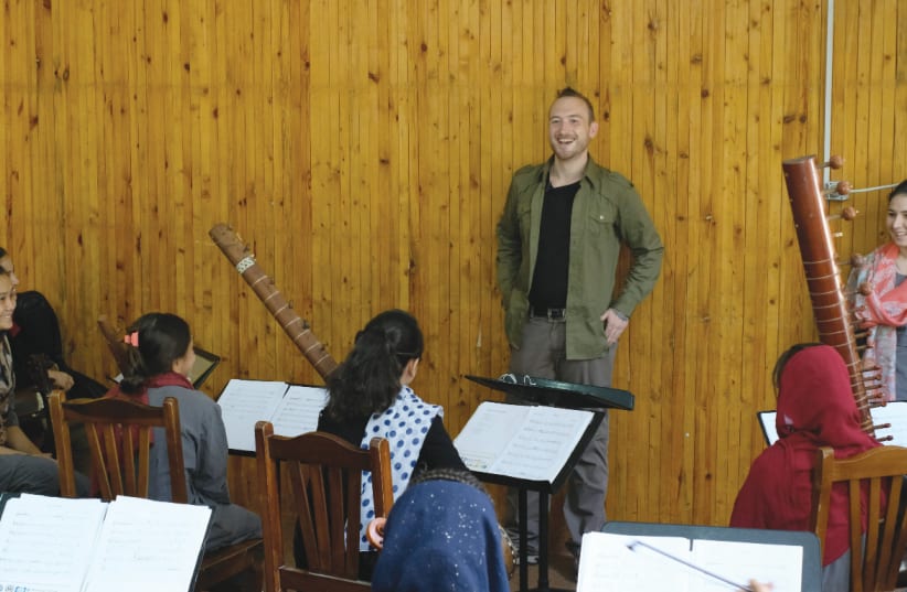 DAN BLACKWELL with members of the Zohra orchestra in Afghanistan. ‘I’m coming to [Israel] from a humanitarian angle with a simple concept – promoting peace and unity and good music. (photo credit: Courtesy)