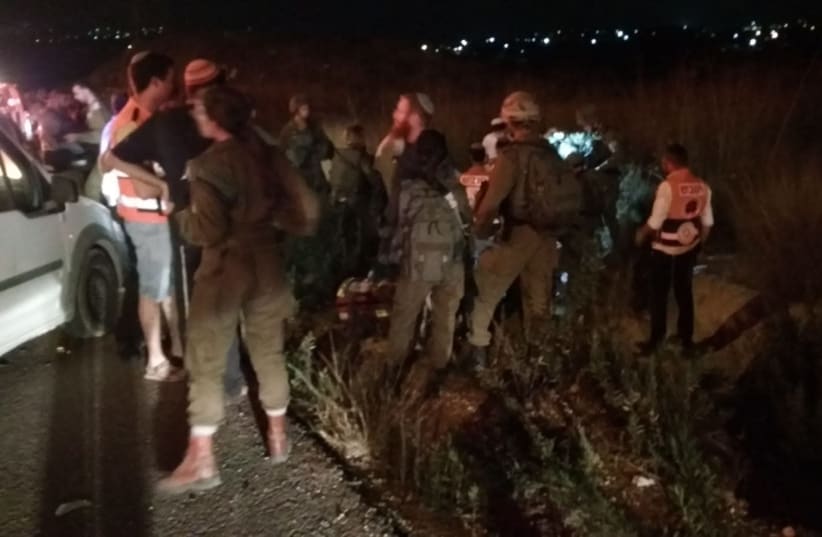 Soldiers gather around car crash site in Havat Gilad, 2018 (photo credit: MAOR LAVI/TPS)