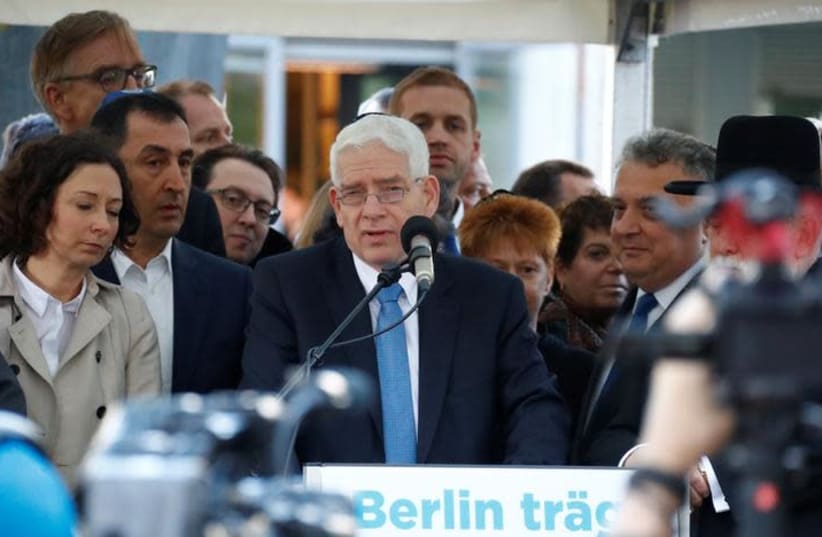 President of the Central Council of Jews in Germany, Josef Schuster, speaks during a demonstration in front of a synagogue (photo credit: REUTERS/FABRIZIO BENSCH)
