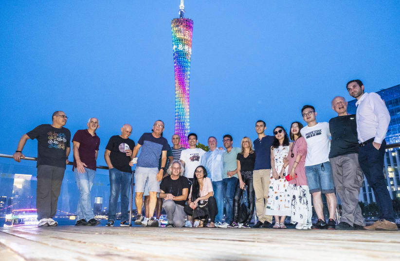 THE ISRAELI JOURNALISTS pose for a photo with their Chinese hosts  at the Canton Tower (photo credit: XIALONG ZHUANG)