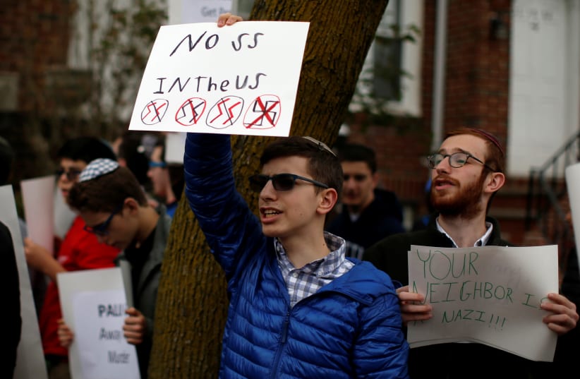 Students from Rambam Mesivta-Maimonides High School protest outside the home of Jakiw Palij in the Queens borough of New York City, US, April 24, 2017 (photo credit: MIKE SEGAR / REUTERS)