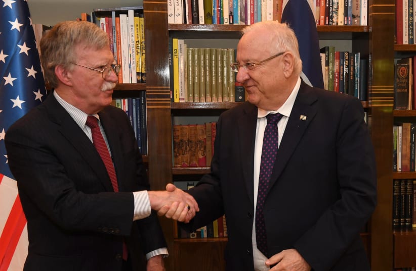 Reuven Rivlin and John Bolton shake hands in Jerusalem August 21, 2018 (photo credit: MARK NEYMAN/GPO)