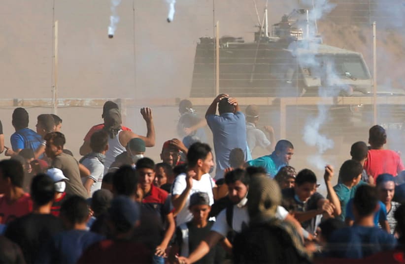gaza protest (photo credit: MOHAMMED SALEM/REUTERS)