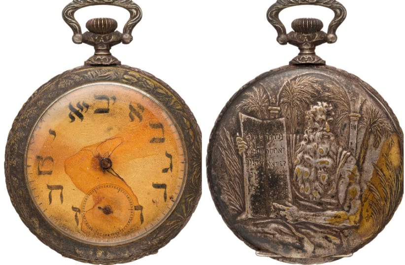 A pocket watch featuring Hebrew letters that belonged to a Jewish Russian immigrant who died aboard the Titanic (photo credit: HERITAGE AUCTIONS HA.COM)