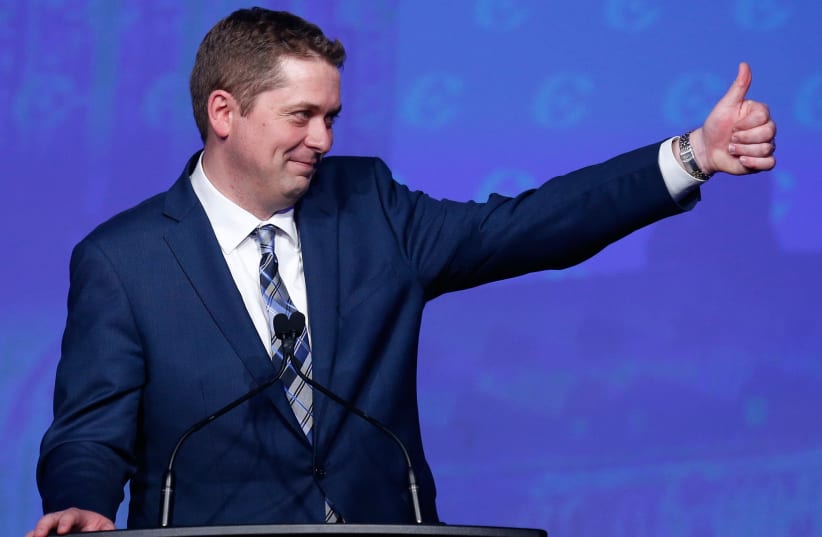 Andrew Scheer celebrates after winning the leadership during the Conservative Party of Canada leadership convention in Toronto, Ontario, Canada May 27, 2017 (photo credit: REUTERS/CHRIS WATTIE)
