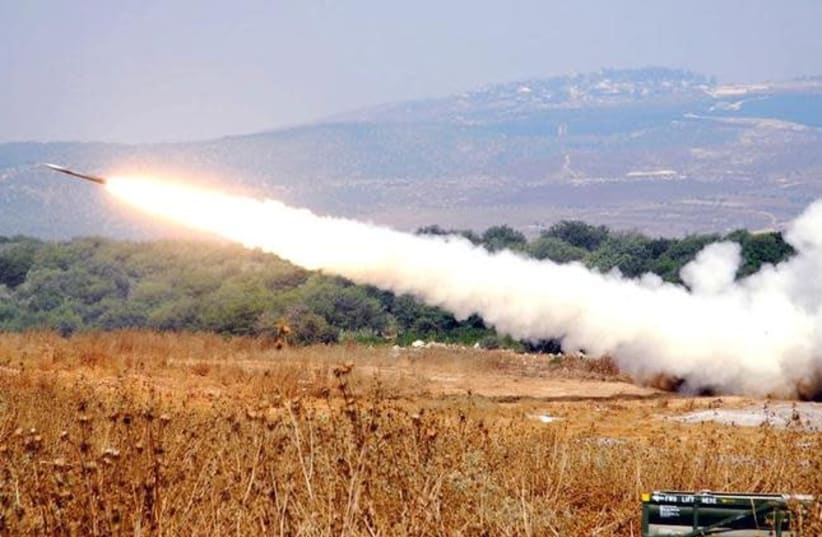 An artillery unit launches a surface-to-surface missile towards southern Lebanon from a position in northern Israel July 16, 2006, in this handout picture released by the Israeli Defense Forces July 17, 2006 (photo credit: REUTERS/AVIV DIVON/HANDOUT/IDF)