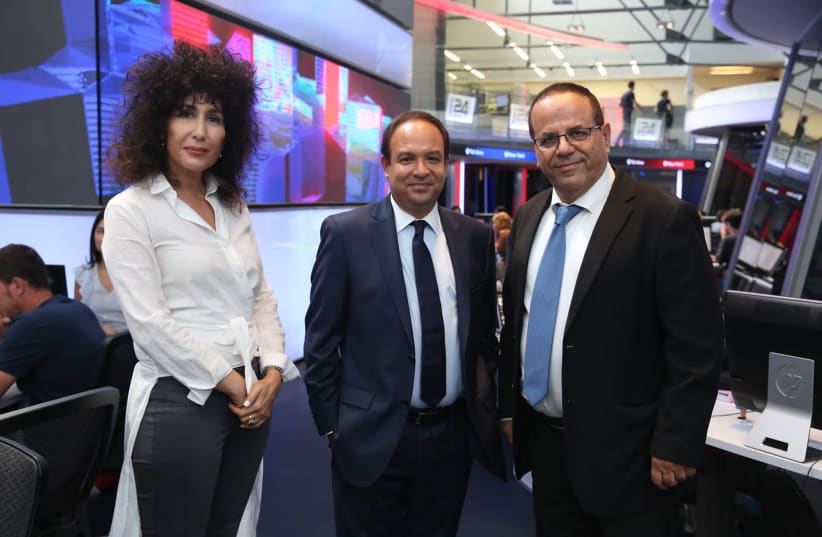 COMMUNICATIONS MINISTER Ayoub Kara (right), i24NEWS CEO Frank Melloul (center) and Yifat Ben Hay-Segev of Israel's Broadcasting Council at the network's offices in Jaffa on Wednesday Aug 29 2018 (photo credit: IDAN MALKA)
