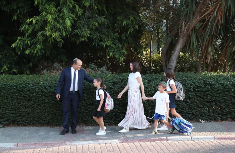 Education Minister Naftali Bennett takes his family to school, Septemer 2, 2018 (photo credit: ODED KARNI/GPO)