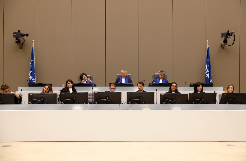Presiding Judge Robert Fremr in the courtroom at the ICC (International Criminal Court) in the Hague, the Netherlands, 2018 (photo credit: BAS CZERWINSKI/POOL VIA REUTERS)