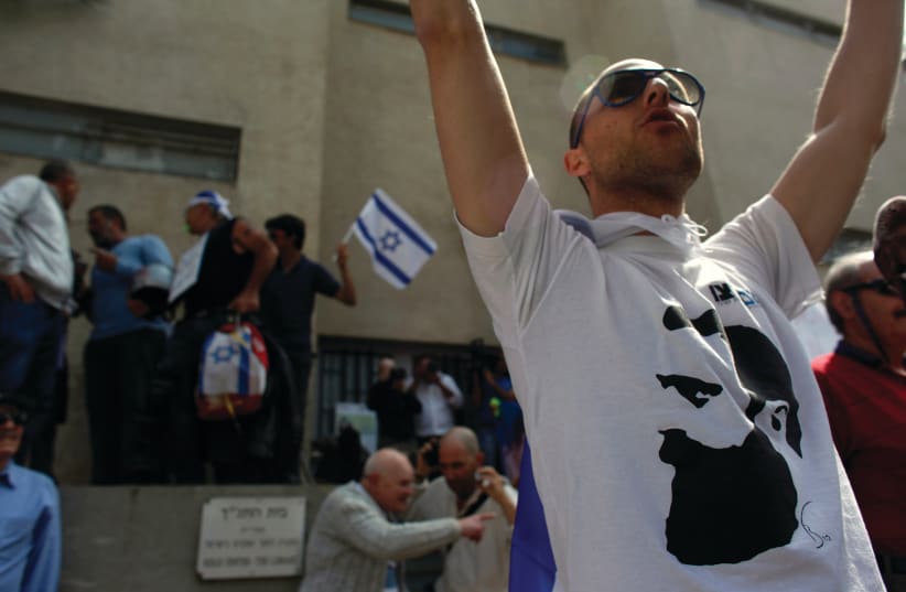 A PROTESTER wears a shirt with Theodor Herzl on it at a rally in Tel Aviv (photo credit: REUTERS)