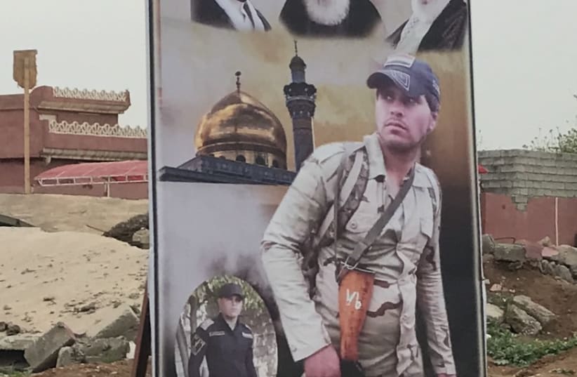 A poster for an Iranian-backed Shia militia in Iraq, one of many the US sees as proxies is Tehran. (photo credit: SETH J. FRANTZMAN)