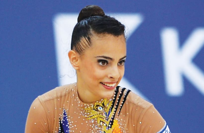 Israeli Linoy Ashram notched a silver medal in the individual Hoops competition at the Rhythmic Gymnastics World Championships this week as she continued to twirl her way toward the 2020 Olympics in Tokyo. (photo credit: OCI/COURTESY)