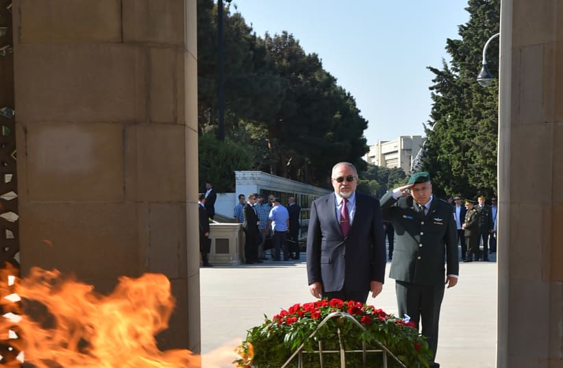 Avigdor Liberman on a visit to Azerbaijan, visiting the Eternal Fire memorial in Baku (photo credit: ARIEL HERMONI / DEFENSE MINISTRY)