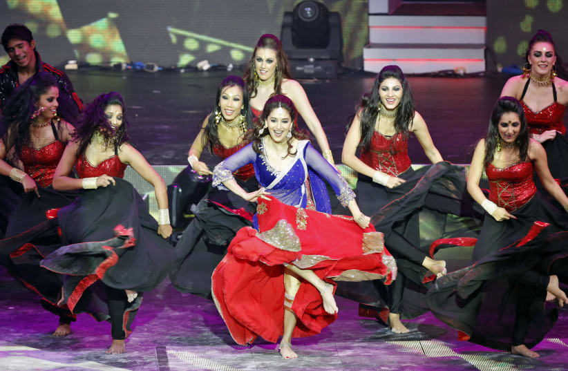 Bollywood actress Madhuri Dixit (C) performs at the 14th annual International Indian Film Academy (IIFA) awards show in Macau July 6, 2013 (photo credit: REUTERS/TYRONE SIU)