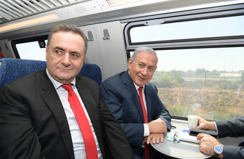 Prime Minister Benjamin Netanyahu and Transportation Minister Israel Katz on inaugural ride of Jerusalem-Tel Aviv high speed rail, September 20, 2018 (photo credit: GPO)