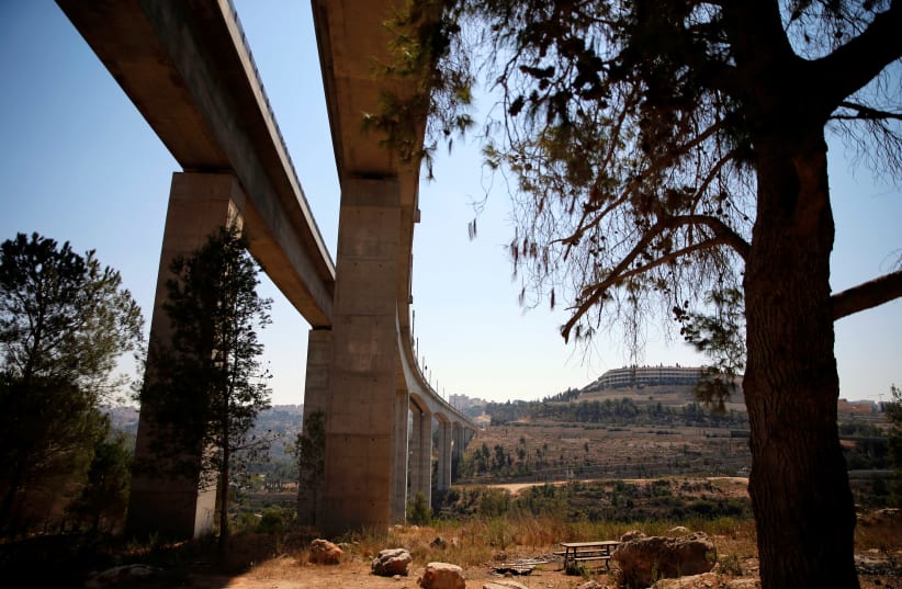 A bridge, part of the tracks of Israel's new high-speed rail line between Jerusalem and Tel Aviv, is seen in the outskirts of Jerusalem (September 23, 2018) (photo credit: REUTERS/AMMAR AWAD)