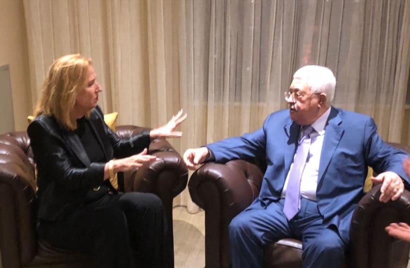 Tzipi Livni speaks with Mahmoud Abbas in New York City in a picture released Wednesday, September 26, 2018 (photo credit: Courtesy)