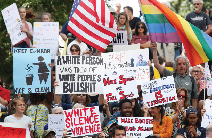 People protesting against racism (photo credit: REUTERS)