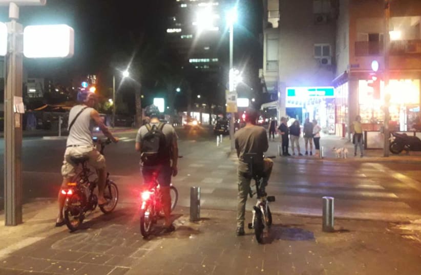 Electric bicyclists use a bike path on Ibn Gvirol, Tel Aviv on Tuesday. A study by NGO Or Yarok  in 114 local councils found bike lanes in only 18% of the areas surveyed.  (photo credit: TAMARA ZIEVE)