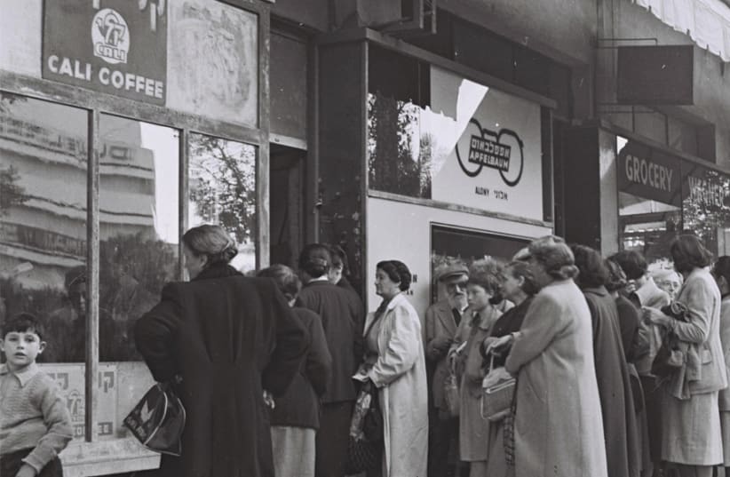 RESIDENTS OF Tel Aviv stand in line to purchase food rations against special coupons, 1954. (photo credit: HANS PINN)