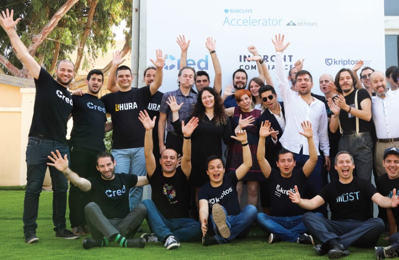 PARTICIPANTS IN the Barclays and Techstars hi-tech accelerator program show their enthusiasm; managing director Hilla Ovil Brenner is in the middle. (photo credit: Courtesy)