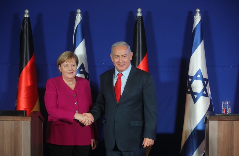Prime Minister Benjamin Netanyahu (R) and German Chancellor Angela Merkel (L) during a press conference, October 4, 2018 (photo credit: MARC ISRAEL SELLEM/THE JERUSALEM POST)