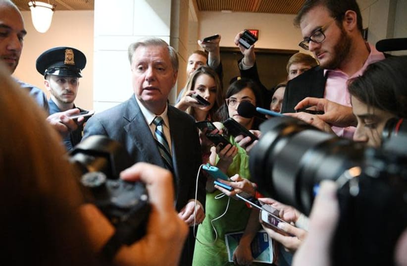 US Senator Lindsey Graham (R-SC) speaks to reporters about the FBI's investigation of sexual assault allegations surrounding U.S. Supreme Court nominee Brett Kavanaugh on Capitol Hill in Washington, US, October 4, 2018 (photo credit: MARY F. CALVERT / REUTERS)