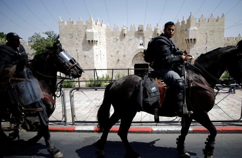 Israeli police ride their horses outside Damascus Gate at Jerusalem's Old city July 28, 2017.  (photo credit: AMIR COHEN/REUTERS)