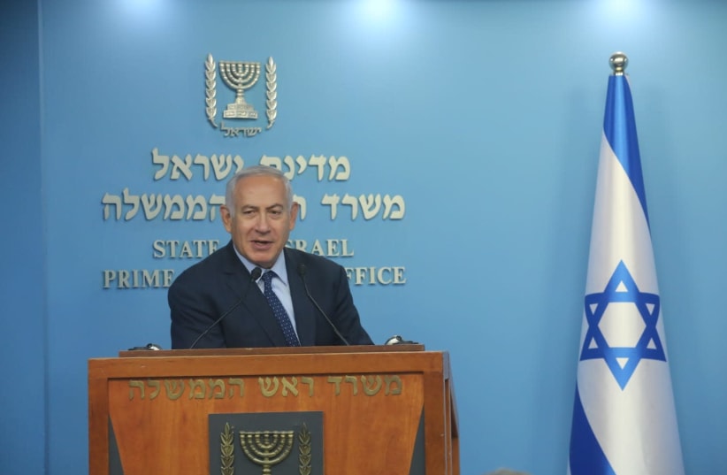 Prime Minister Benjamin Netanyahu speaking to reporters, October 9, 2018 (photo credit: MARC ISRAEL SELLEM/THE JERUSALEM POST)