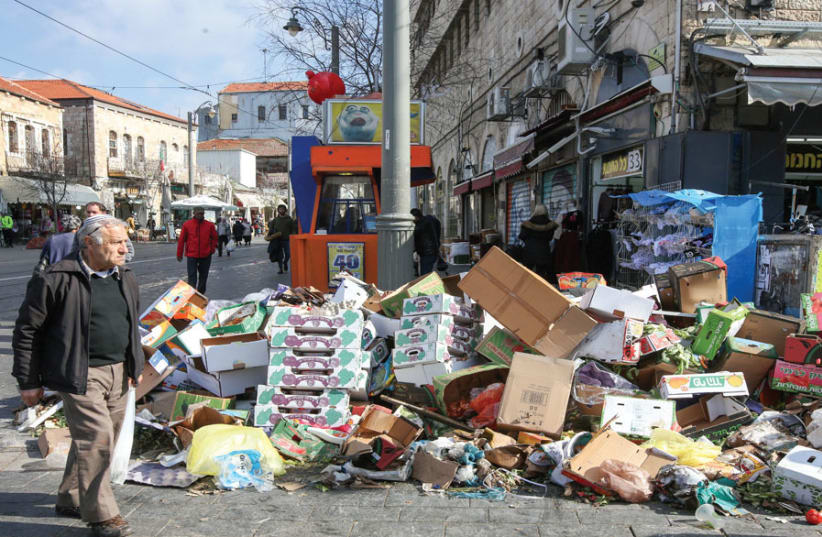 Trash piles up near the shuk during last winter’s sanitation strike. (photo credit: MARC ISRAEL SELLEM)