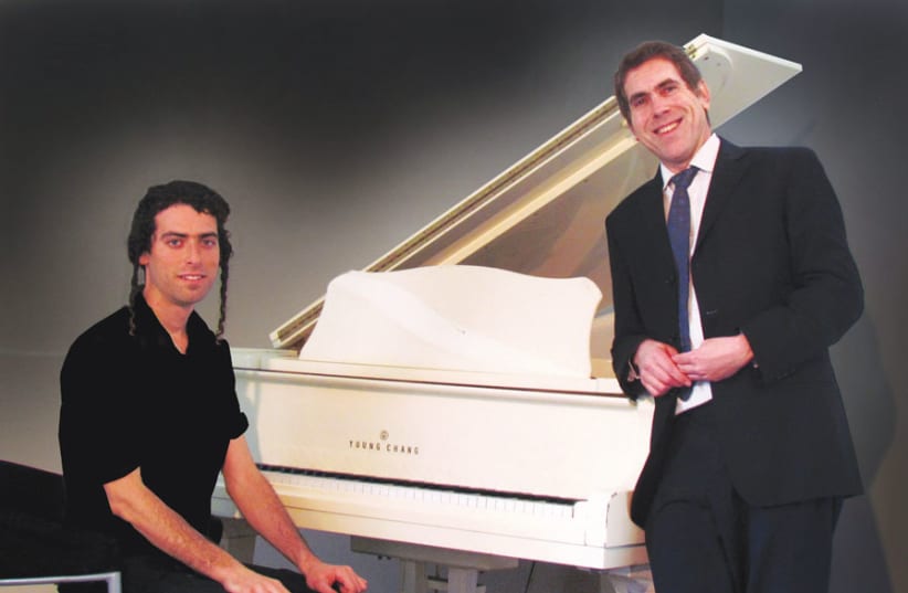 TUKACHINSKY AT the keyboard in a publicity photo with Yisrael Lutnick, with whom he performed for the ‘Sinatra’ concert and other shows. (photo credit: AMY LUTNICK)