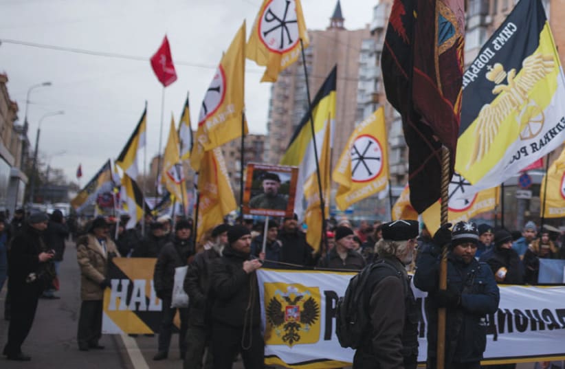 MEMBERS OF a Russian nationalist group attend a march of the Unity of Nation in Moscow last year. (photo credit: EKATERINA ANCHEVSKAYA/REUTERS)