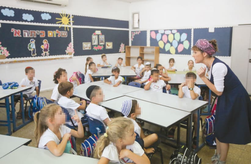 First-grade pupils attend the first day of a school in Jerusalem on September 2 (photo credit: MARC ISRAEL SELLEM)
