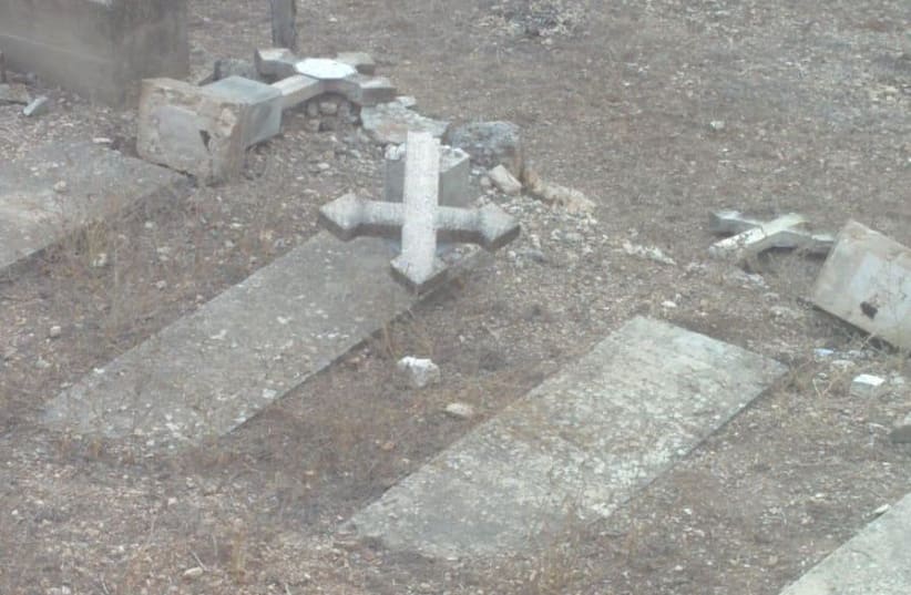 Vandalism at a cemetery of a Catholic monastery in Beit Shemesh on October 18, 2018. (photo credit: TAG MEIR)