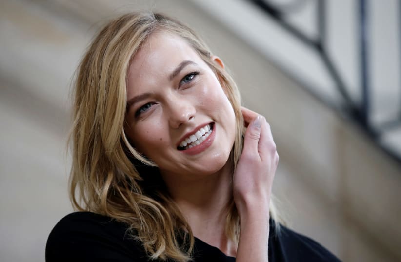 Model Karlie Kloss poses during a photocall before the French fashion house Christian Dior Fall/Winter 2017-2018 women's ready-to-wear collection during Fashion Week in Paris, France March 3, 2017 (photo credit: REUTERS/GONZALO FUENTES)