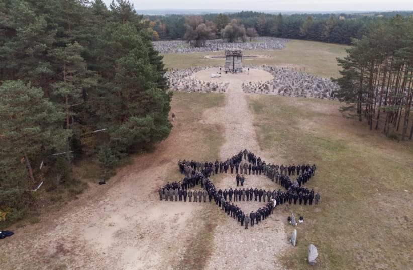 Israel Police posing in formation for at one of the historical sites during the Poland delegation (photo credit: ISRAEL POLICE)