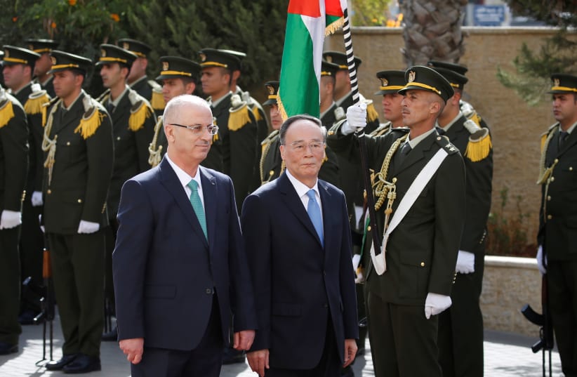 Chinese Vice President Wang Qishan and Palestinian PM Rami Hamdallah, reception ceremony in Ramallah, 2018. (photo credit: ABBAS MOMANI/POOL VIA REUTERS)