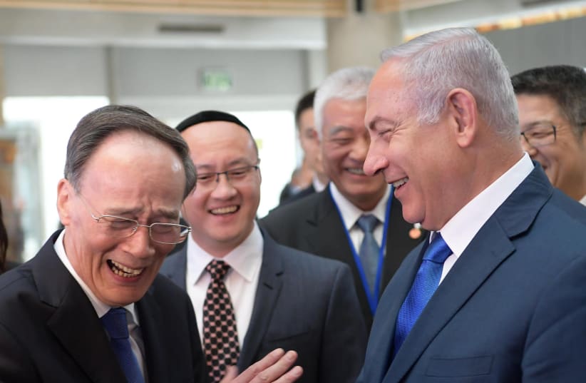 Vice President of the People's Republic of China Wang Qisham [L] and Prime Minister Benjamin Netanyahu [R] (photo credit: AMOS BEN-GERSHOM/GPO)