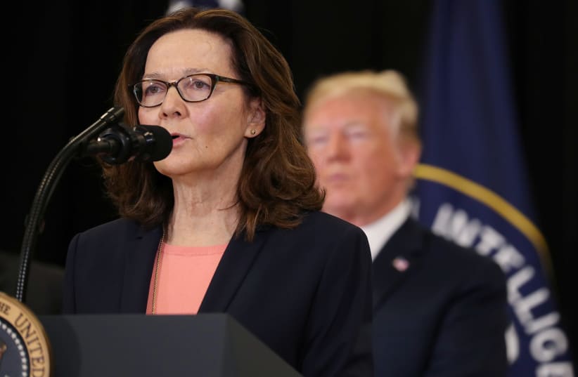 New CIA Director Gina Haspel speaks as President Donald Trump looks on after Haspel was sworn in during ceremonies at the headquarters of the Central Intelligence Agency in Langley, Virginia, U.S. May 21, 2018 (photo credit: REUTERS/KEVIN LAMARQUE)