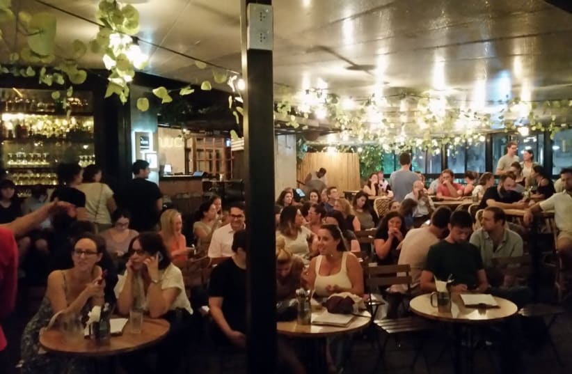 Immigrants hear Tel Aviv mayoral candidates at the city's Kanta bar (photo credit: JAY ROSEN)
