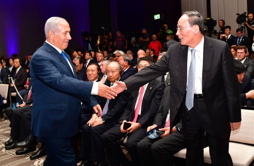 Prime Minister Benjamin Netanyahu greets Chinese VP Wang Qishan at the Innovation Conference in Jerusalem (photo credit: GPO/KOBI GIDEON)