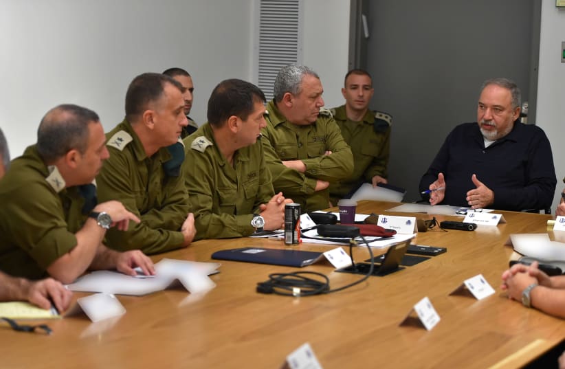Defense Minister Avigdor Liberman speaking with IDF officers during a special Gaza evaluation meeting  (photo credit: DEFENSE MINISTRY)