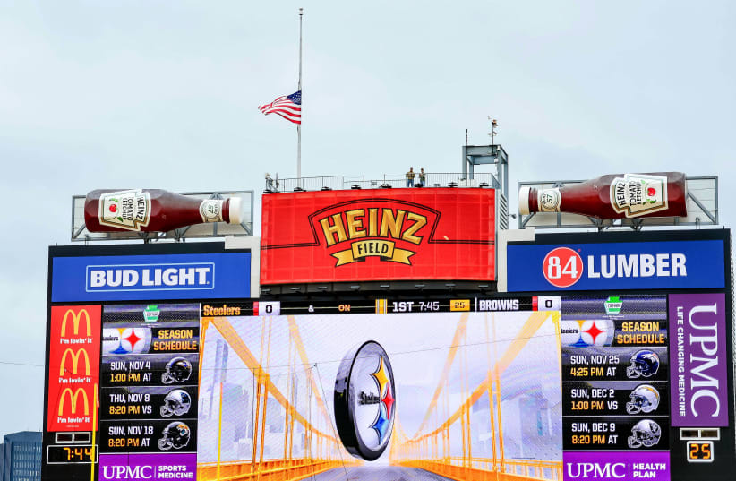 Pittsburgh, PA, USA - Heinz field in Pittsburgh lowers the flag to half-staff to honor the victims of the shooting at the Tree of Life Synagogue before the game between the Pittsburgh Steelers and the Cleveland Browns (photo credit: JEFFREY BECKER-USA TODAY SPORTS)