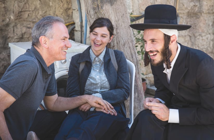 Joy Rieger enjoys a light moment with Avi Nesher (left) and Nathan Goshen (photo credit: MICHAL FATTAL)